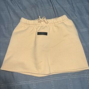 ESSENTIALS skirt. Purchased longer and personally altered into a mini skirt.